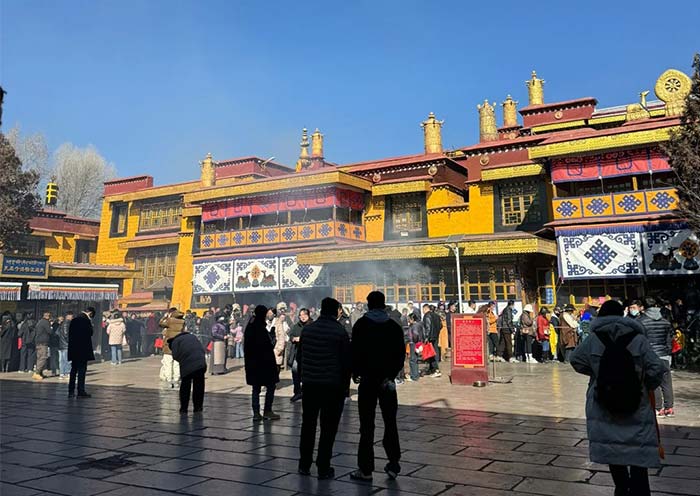 Zaji Temple is the most famous wealth temple in Lhasa. This image depicts the traditional morning pilgrimage where locals bring white wine as an offering to the Goddess.