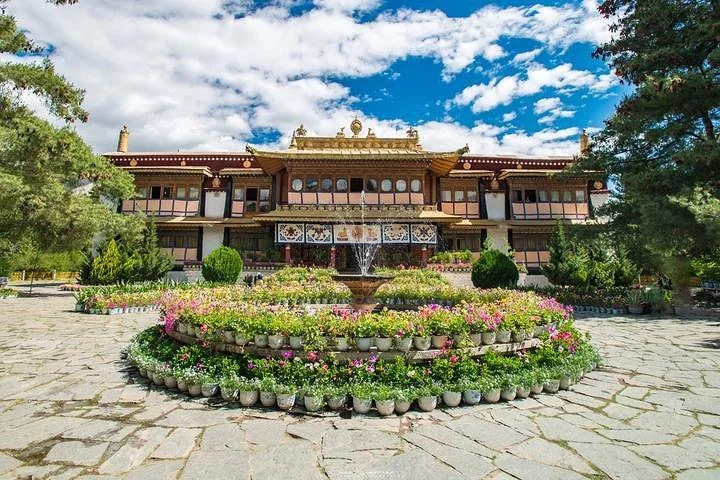 The fountain and garden in front of Kelsang Phodrong Palace inside Norbulingka.