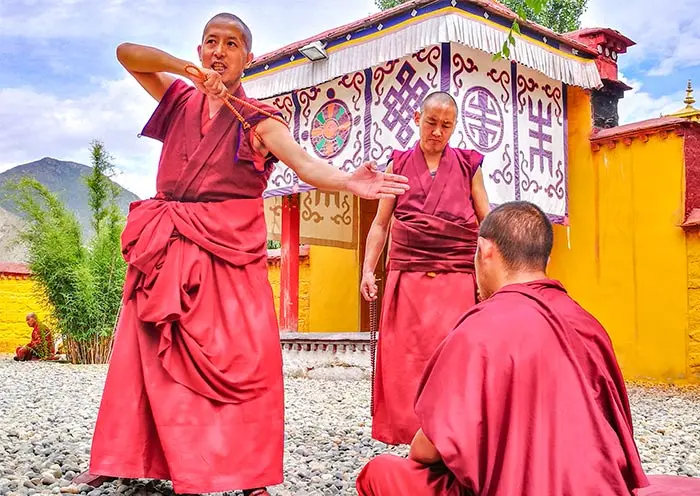 The debating monks of Sera Monastery are a highlight of Lhasa tourism. This image captures the essence of Tibetan Buddhist dialectics and the unique scholarly atmosphere of the plateau.