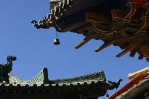 Detailed view of the eaves and decorative elements at Shalu Monastery in Shigatse.